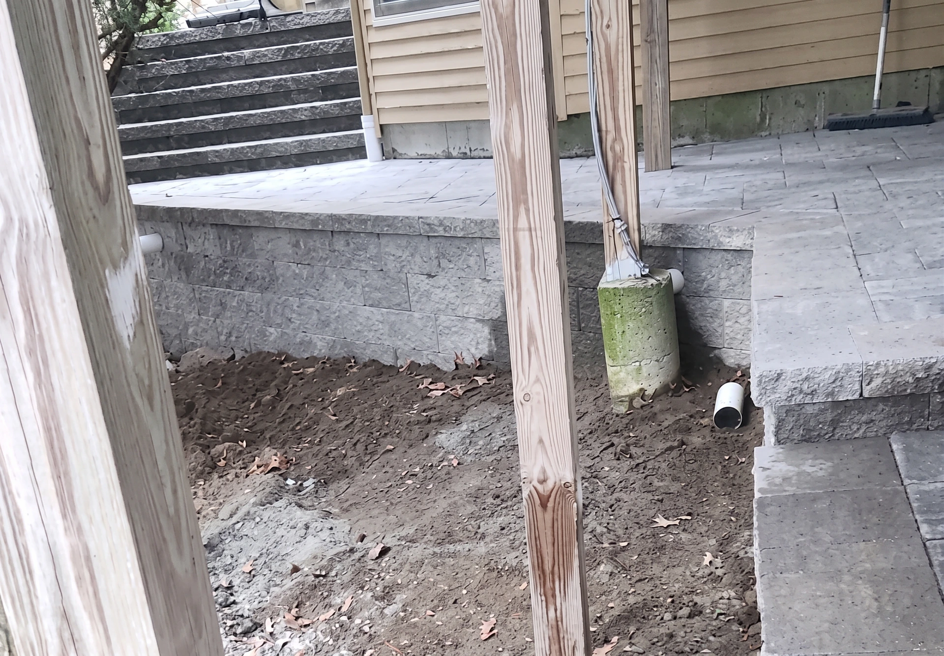 Concrete surface with installed masonry finish