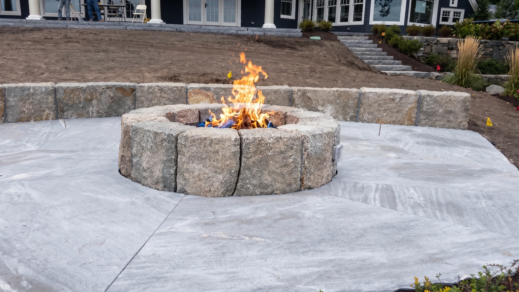 Masonry fireplace or fire feature with detailed stone installation
